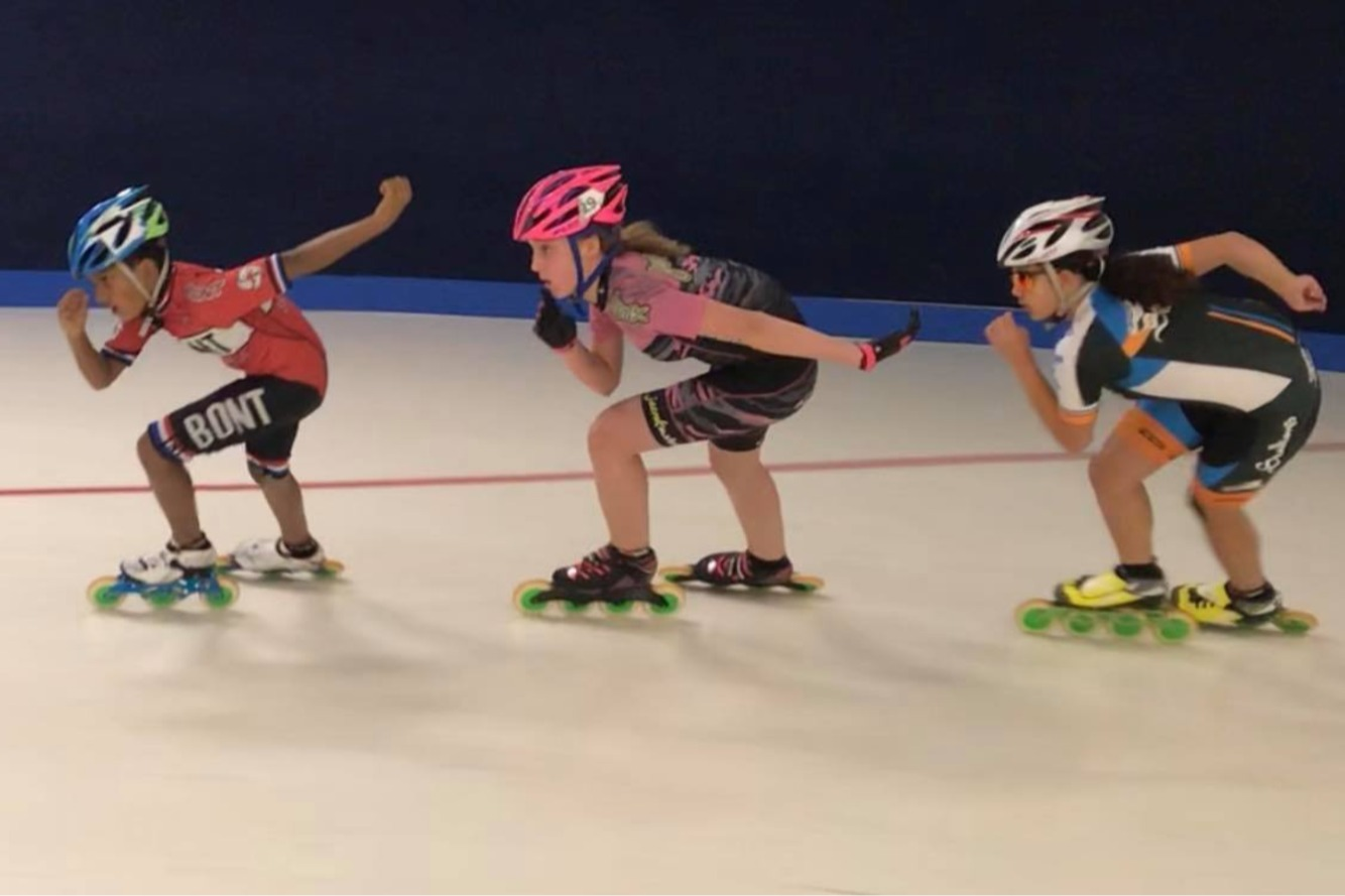 Skater practicing speed skating techniques at Skate City Sports indoor rink in Colorado Springs